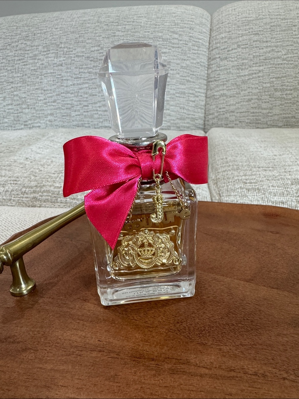 Juicy Couture Perfume Bottle with Hot Pink Bow and Gold Emblem